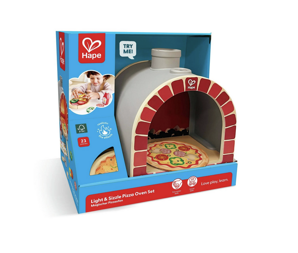 The Light and Sizzle Pizza Oven Set packaged in an open box, with a "try me" button so anyone can experience the sounds the toy pizza oven makes. 