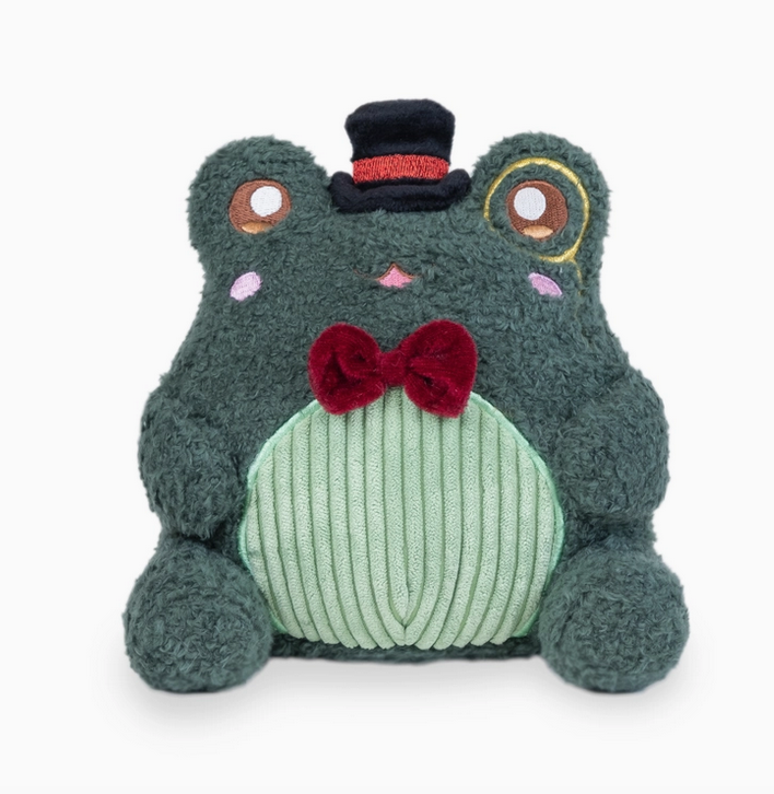 Dark green frog plush wearing a black top hat with a burgundy bow tie and light green chenille tummy.