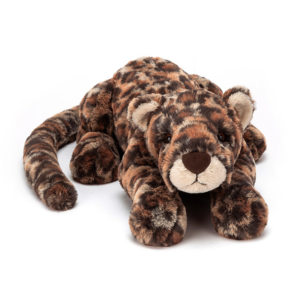 Plush leopard laying down with it's head on it's paws. 