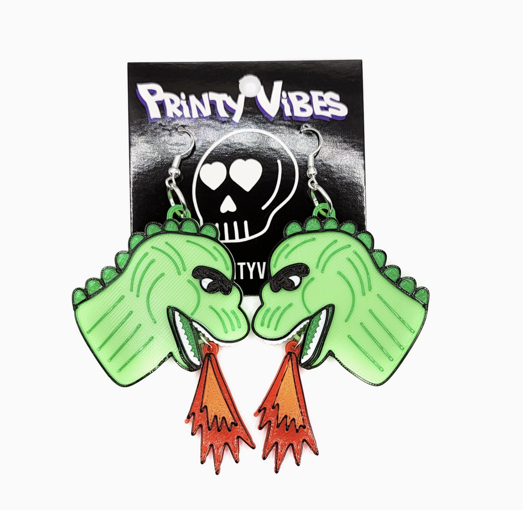 Lizard King Kaiju Earrings displayed on a hang card with Printy Vibes logo. 