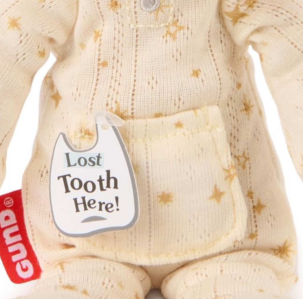 A close up picture of the little pocket on the front of Toothpick Bear's pajamas that can hold a lost tooth or note. 