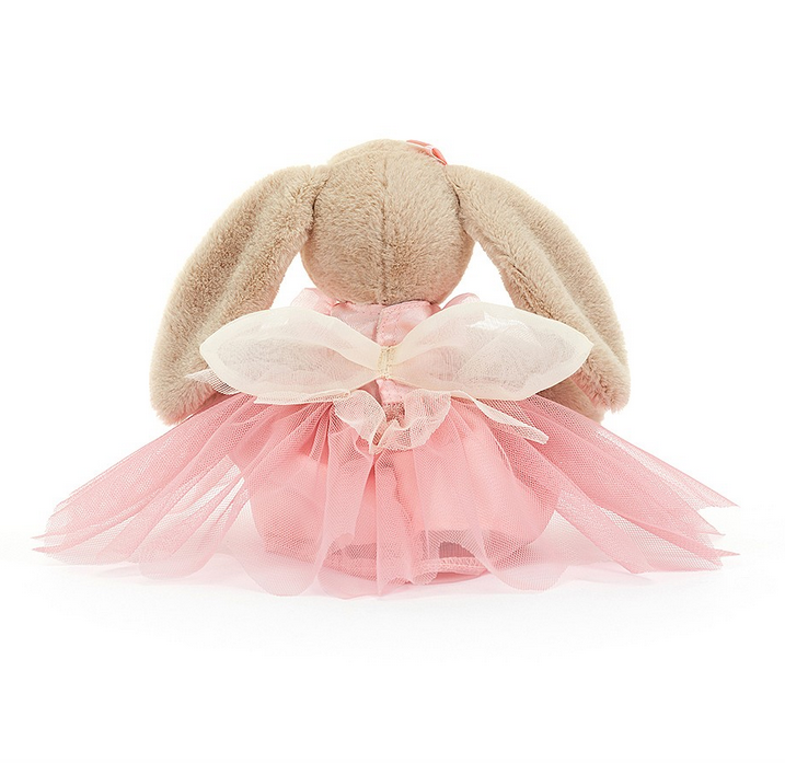 Back view of Lottie Bunny Fairy showing off her pink tuille skirt and white tuille fairy wings. 