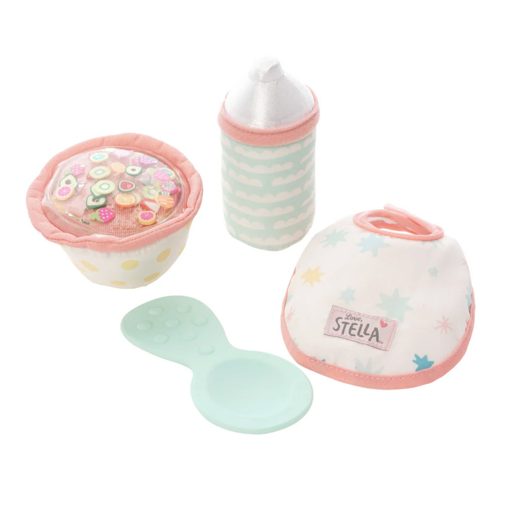 Items from the Love, Stella Feeding Set which consists of a baby doll bib, bottle, bowl and silicone spoon. 