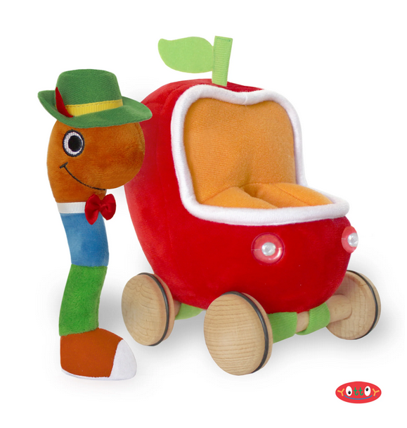 Lowly Worm Soft Toy stands 7.5" tall, dressed in his rich blue and green outfit, red sneaker, bow tie, and green alpine hat with yellow grosgrain trim. Lowly's Applecar has headlights and working wooden wheels to roll into new discoveries.