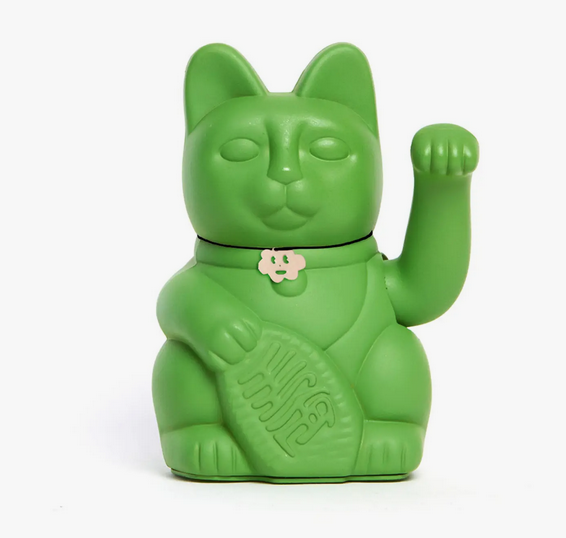 Bright green Lucky Cat statue with waving arm and holding a banner that translate to "Good Luck" 