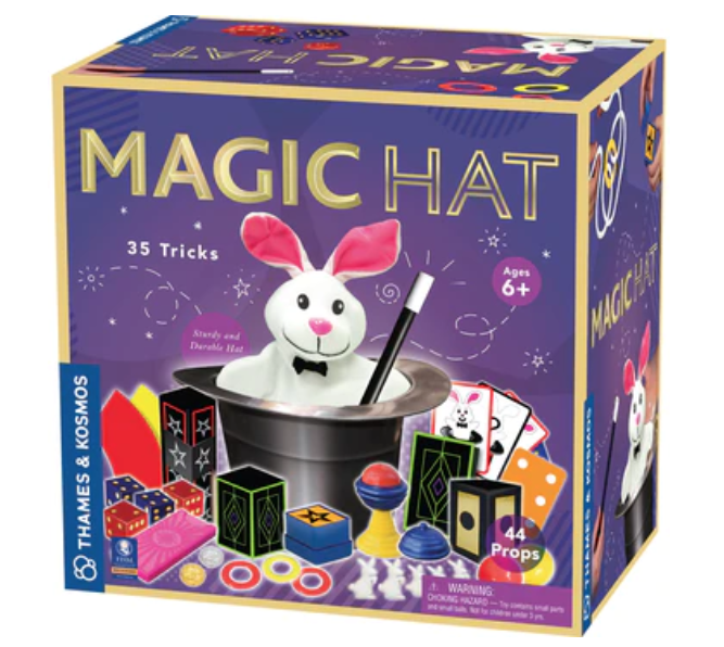 Purple and gold box with a picture of the Magic Hat Tricks Set featuring a plush rabbit and wand inside a black hat and other accessories used to perform tricks. 