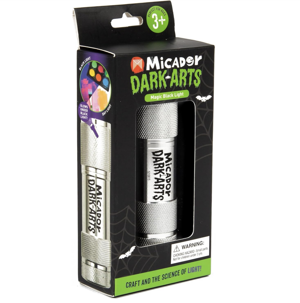 Dark Arts Magic Torch Black Light packaged in a black box with bright green lettering and a see through window. 