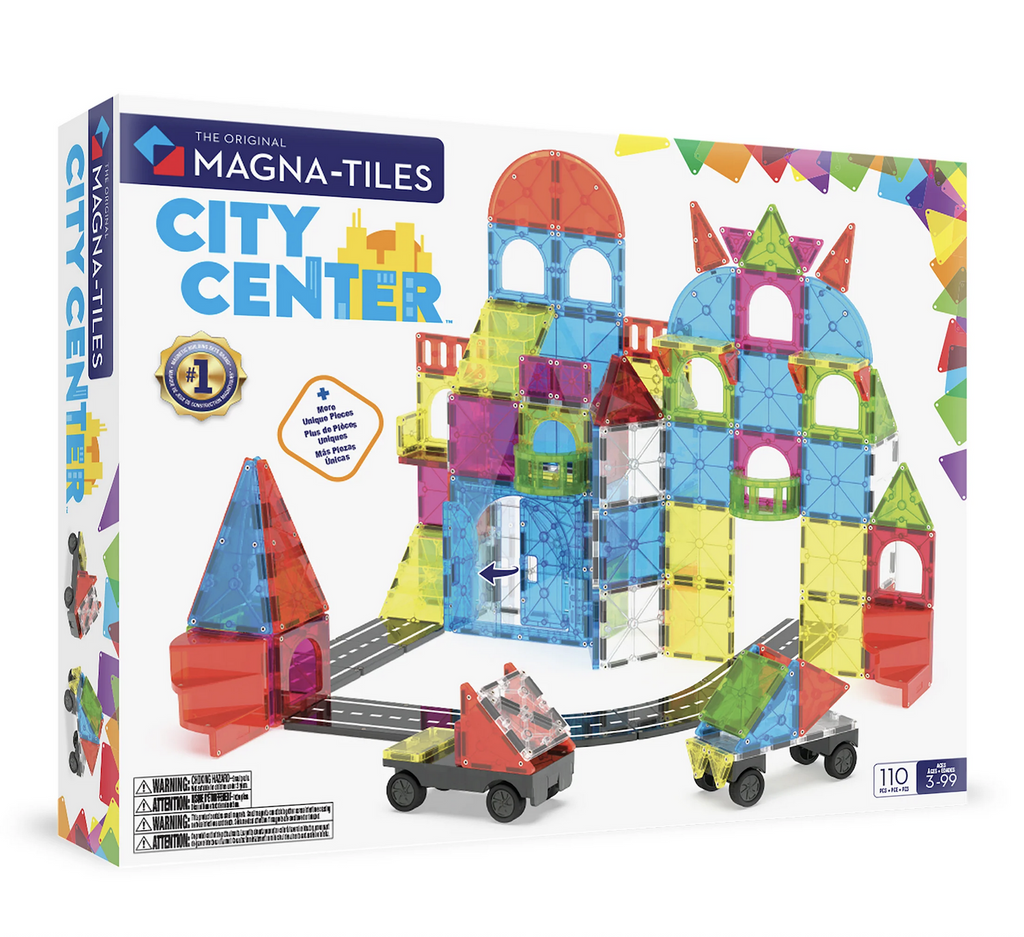 White box with a picture of the colorful magnetic pieces that make up the Magna Tiles City Center Set. There are different sized triangles, squares, road pieces, and wheels included. 