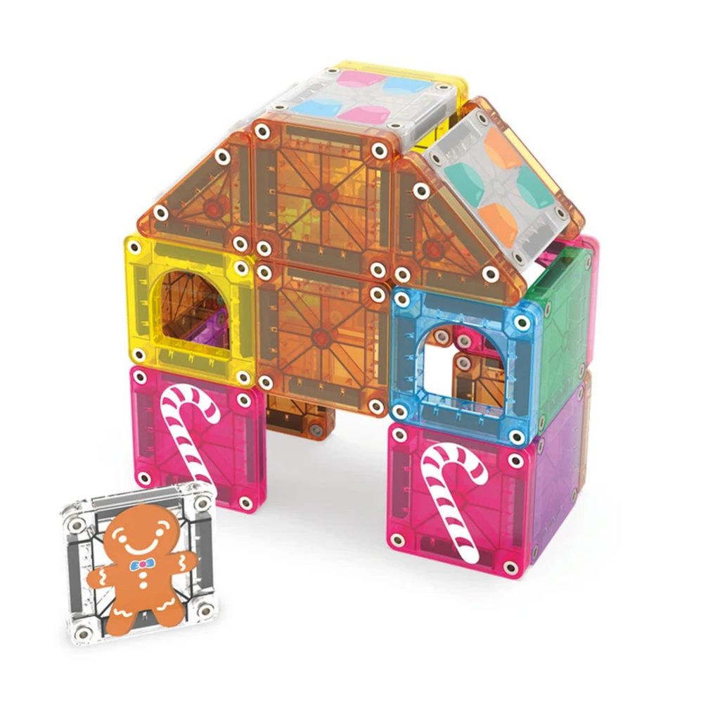 A candy-colored cottage, decorated with candy cane and gumdrop tiles from the Gingerbread House MicroMags travel set. 