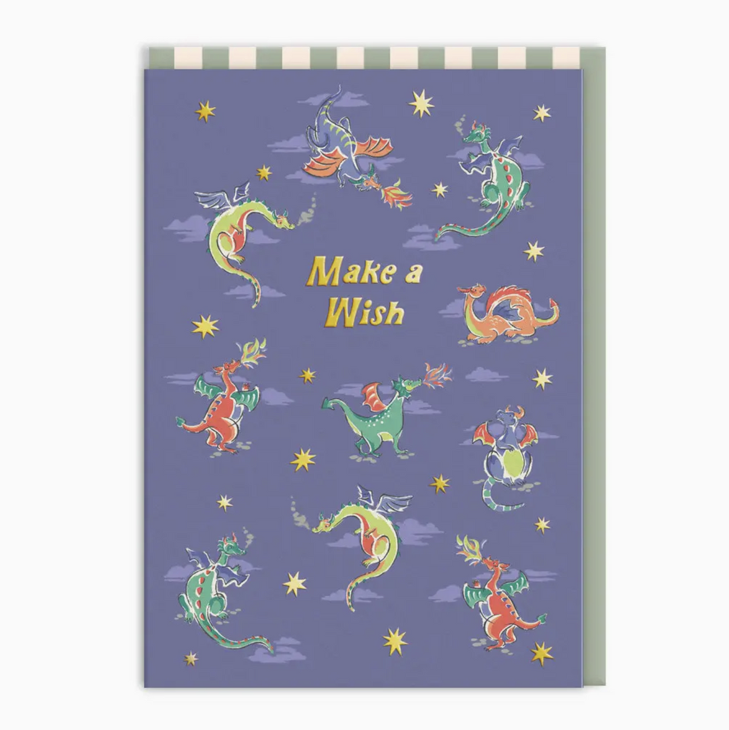 Illustrated greeting card with little dragons of all different colors that reads "Make a Wish"