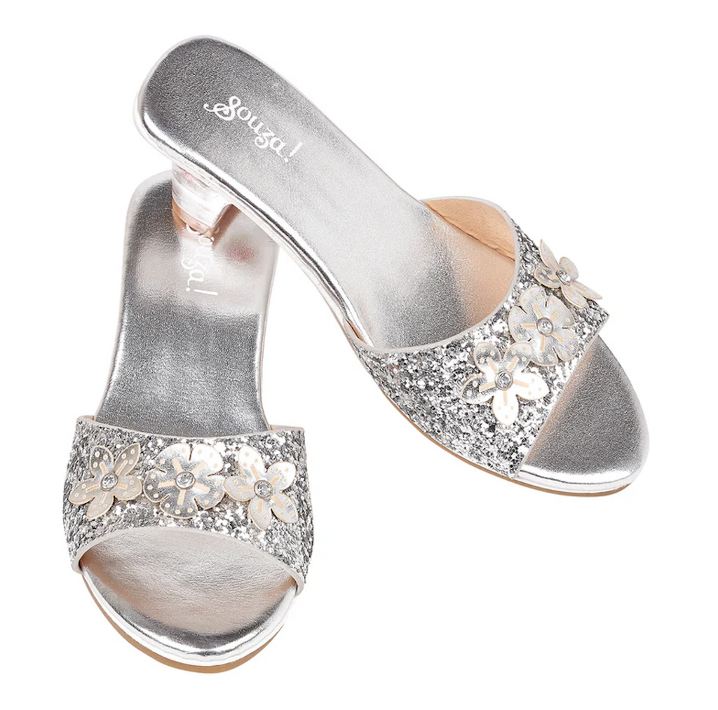 Sparkly silver dress up slippers for kids. There is a small clear heel and three glittery flowers across the top of the foot. 