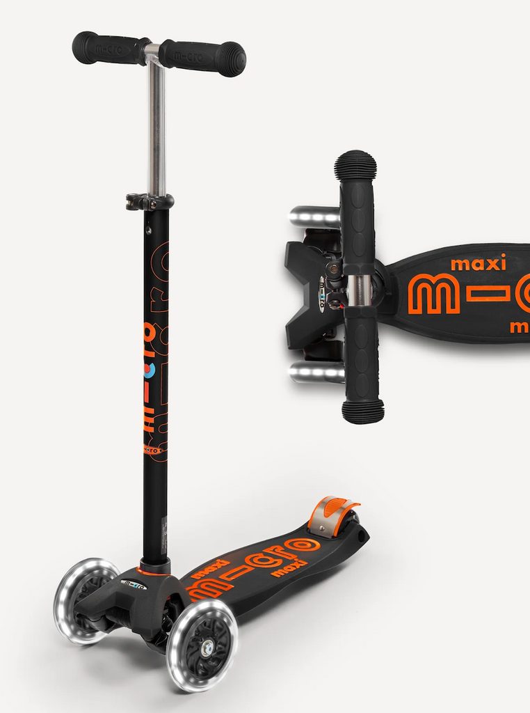 Maxi LED Deluxe Scooter in black and orange with LED light up wheels. 