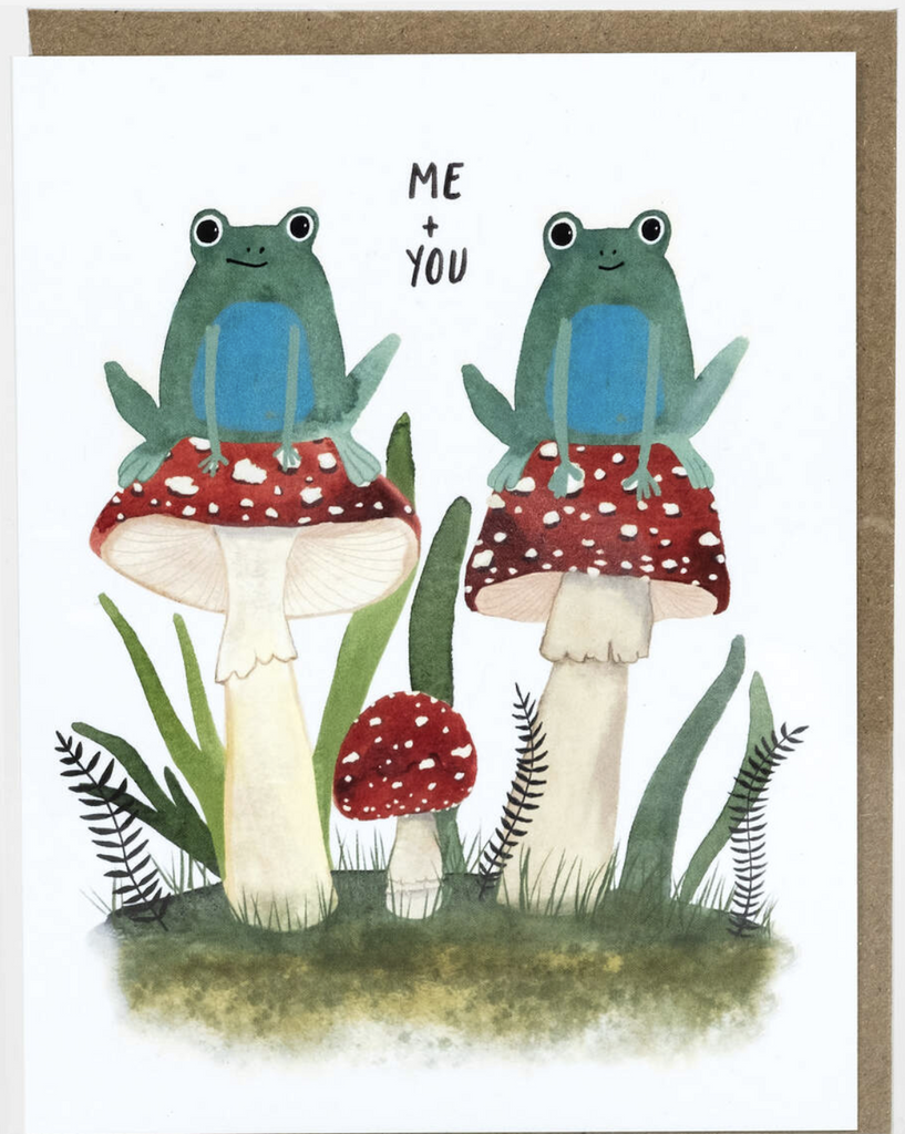 Cute illustration of two frogs sitting on toadstools in the grass that reads "Me and You"