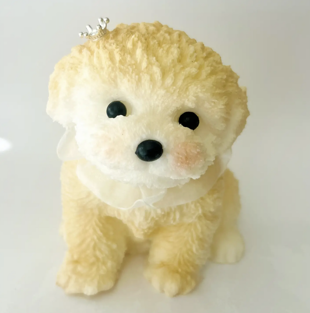 A cute, fluffy dog wearing a tiny crown and is a jumbo sized  squish toy. 