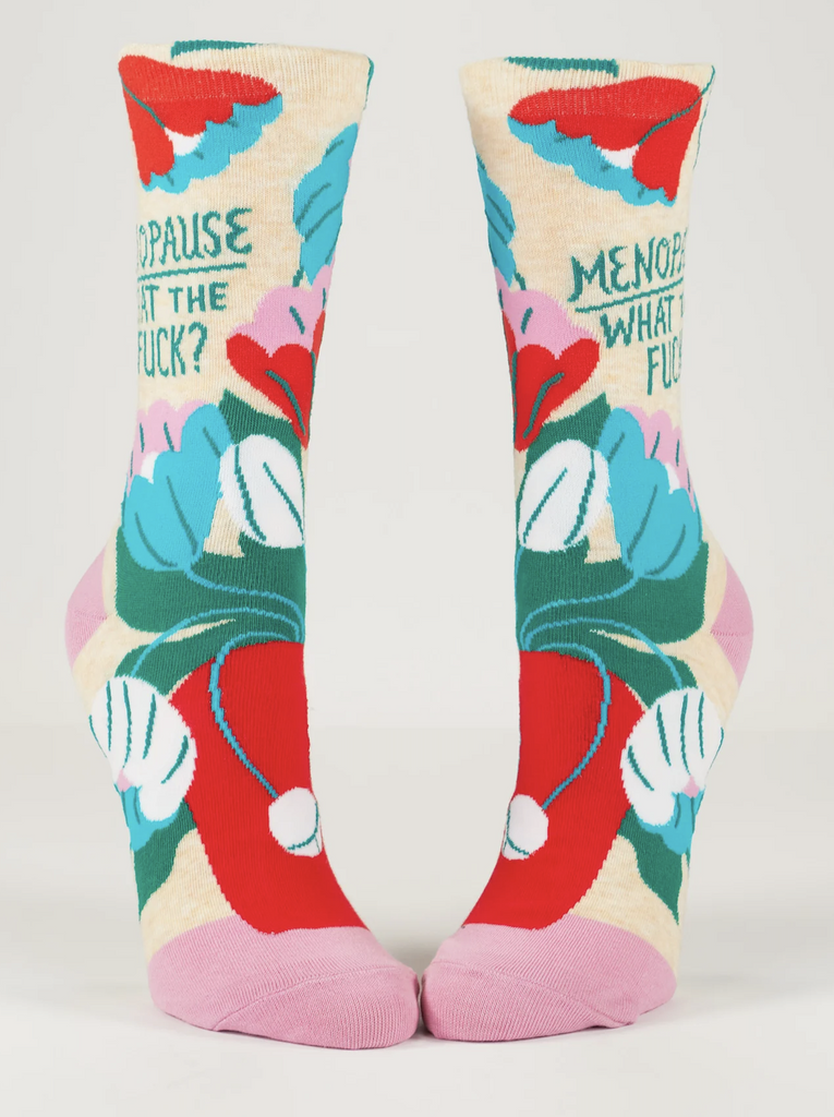 Socks with colorful floral graphics all over that read "Menopause, What the fuck?