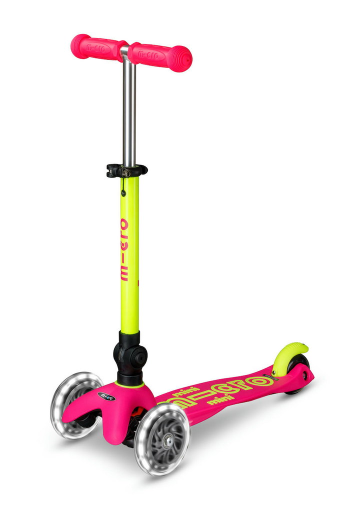 The Neon Flamingo Micro Mini Scooter with the handle bar extended into the upright position. 