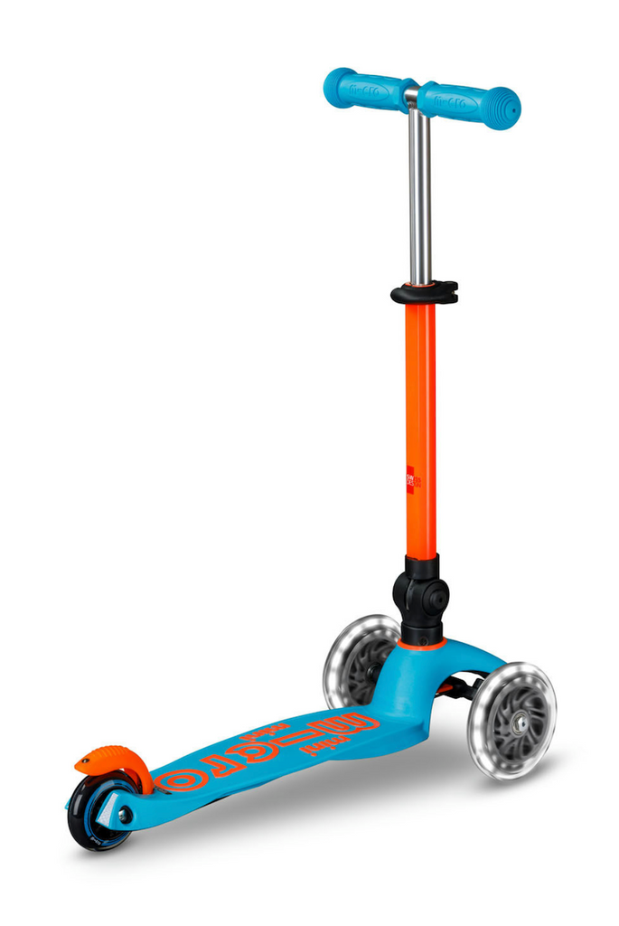 The Ocean Blue Micro Mini Scooter with the handlebar extended into the upright position and ready to be taken for a ride. 