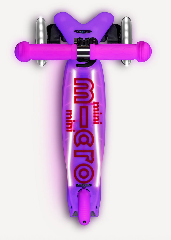 Micro Mini Glow Plus LED Scooter in frosty pink viewed from above to show the LED lights on the deck and and wheels. 