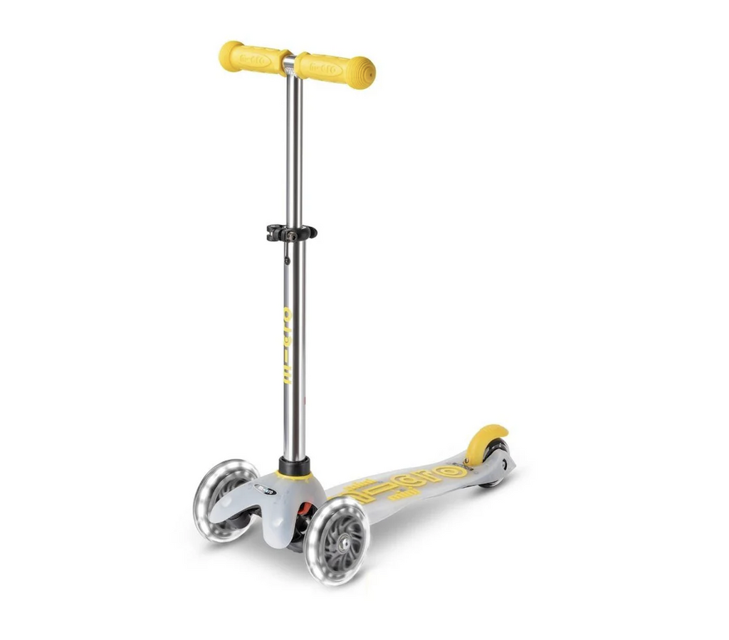 The Micro Mini Flux LED Scooter in Yellow, with light up LED wheels. 