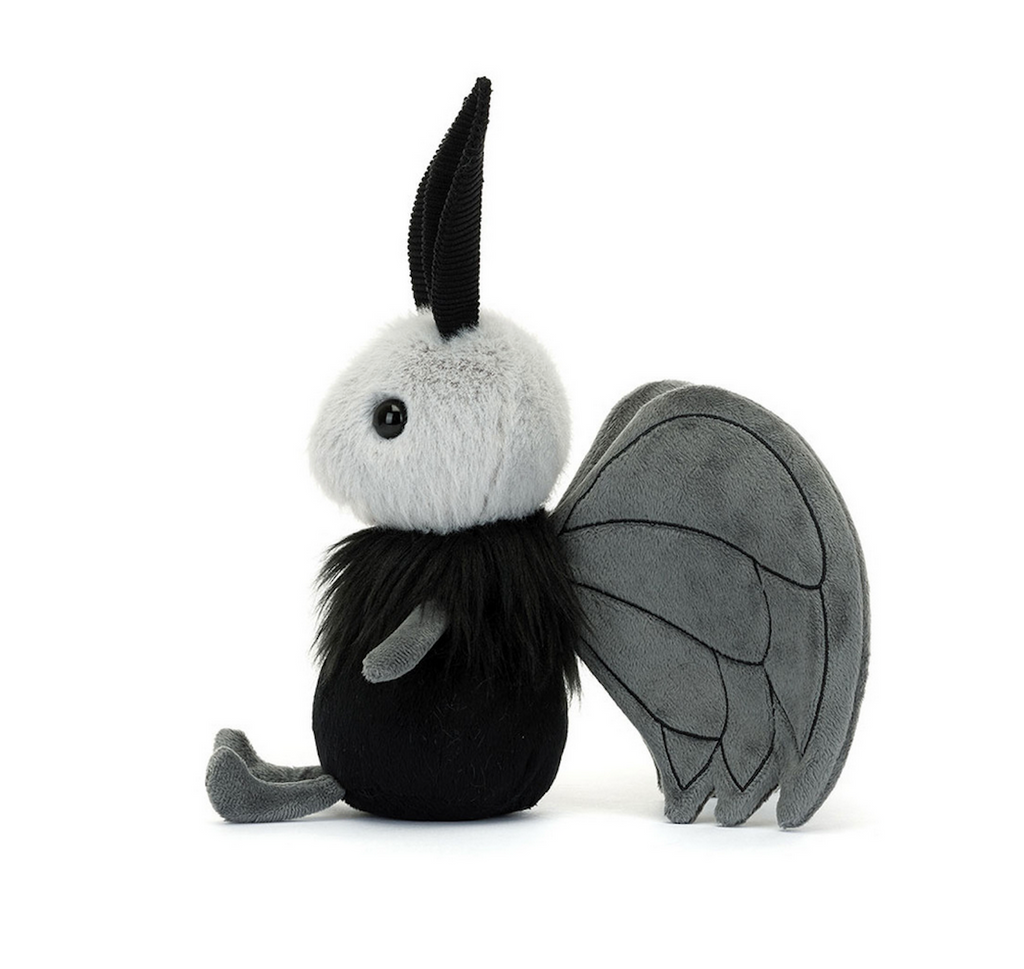 Miff Mothman stuffed animal sitting upright and viewed from the side. 