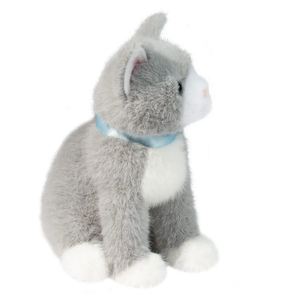 The Mini Grey Cat sitiing up facing to the left has a smoky grey coat, sweet brown eyes and a blue satin ribbon around his neck.