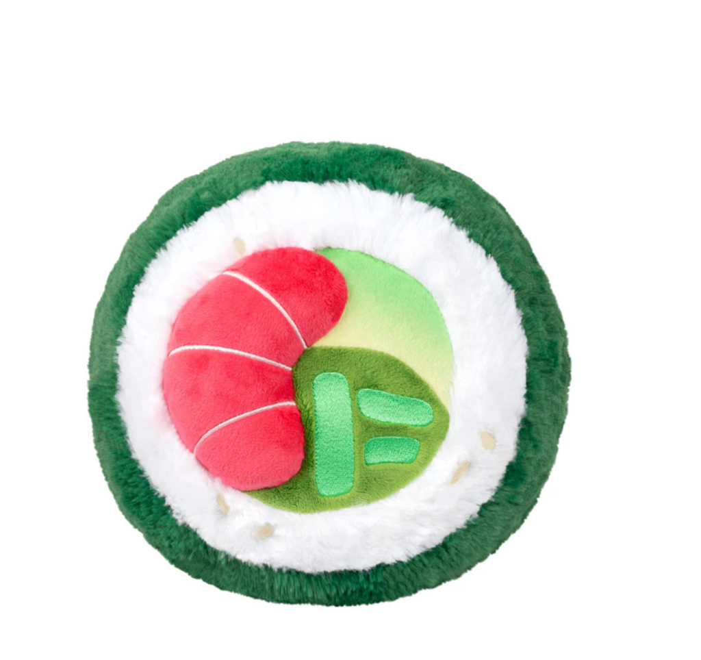 Top view of the Mini squishable sushi roll shows plush shrimp, avocado, and rice in a green roll.