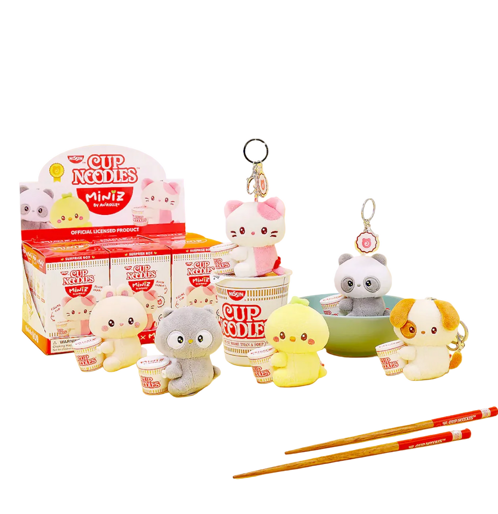 Each of the Cup Noodles Miniz character plush figures, keychains arranged in front of a full case pf the surprise boxes that look like a miniature cup noodles. 