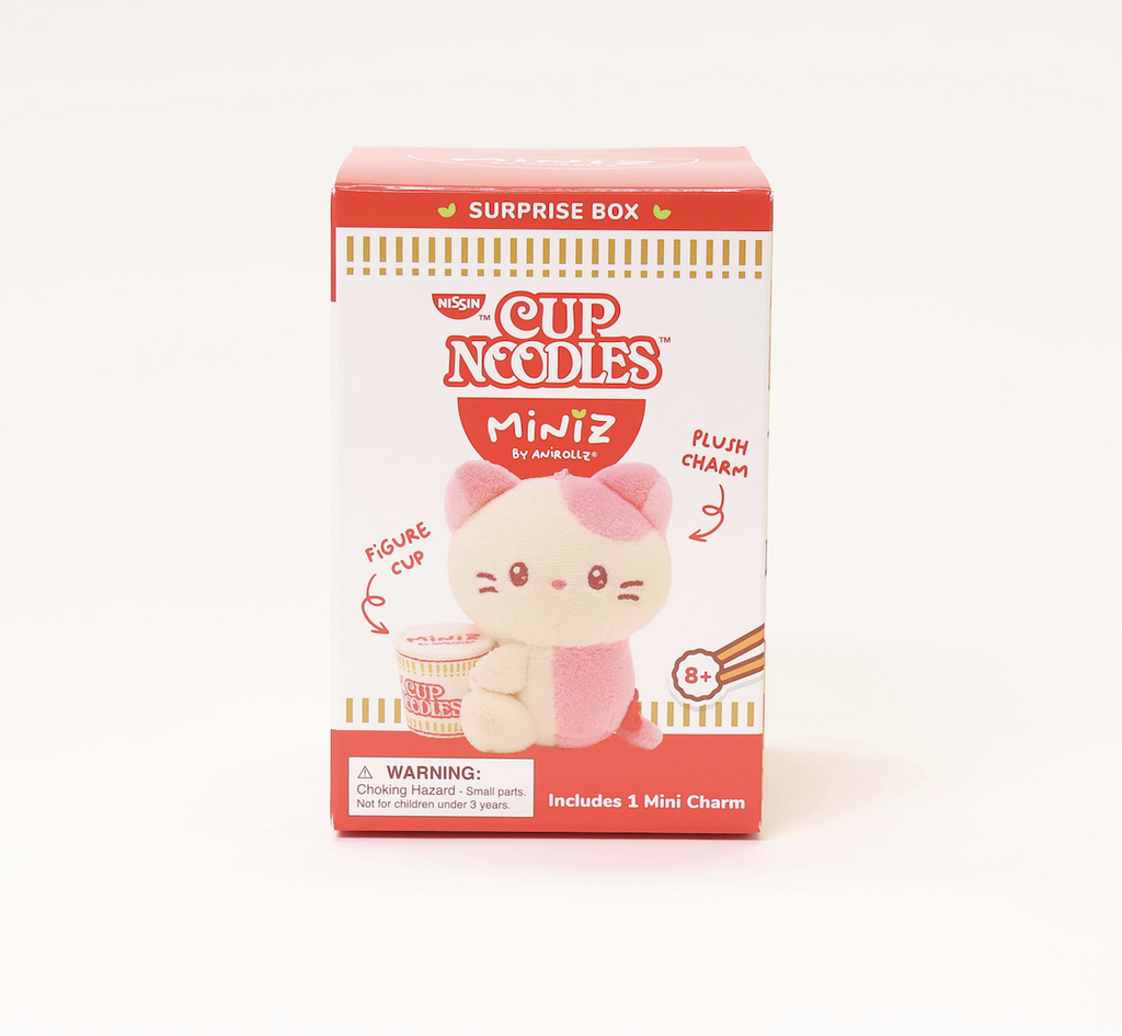 Miniz Cup Noodles Surprise Box featuring a pink and white plush cat charm holding a a Cup Noodles in front of them. 