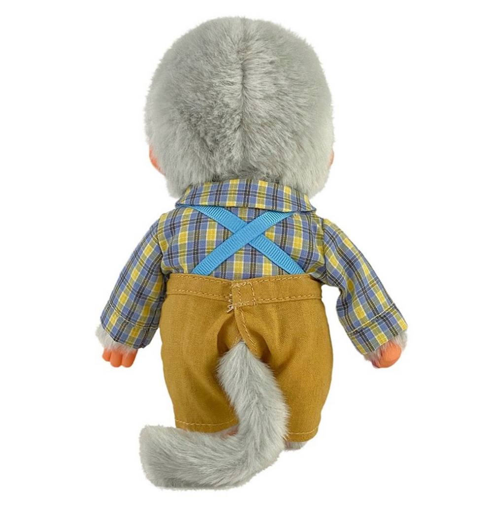 Rear view of Grandpa Monchhichi plush doll showing his tail sticking out of his pants. 