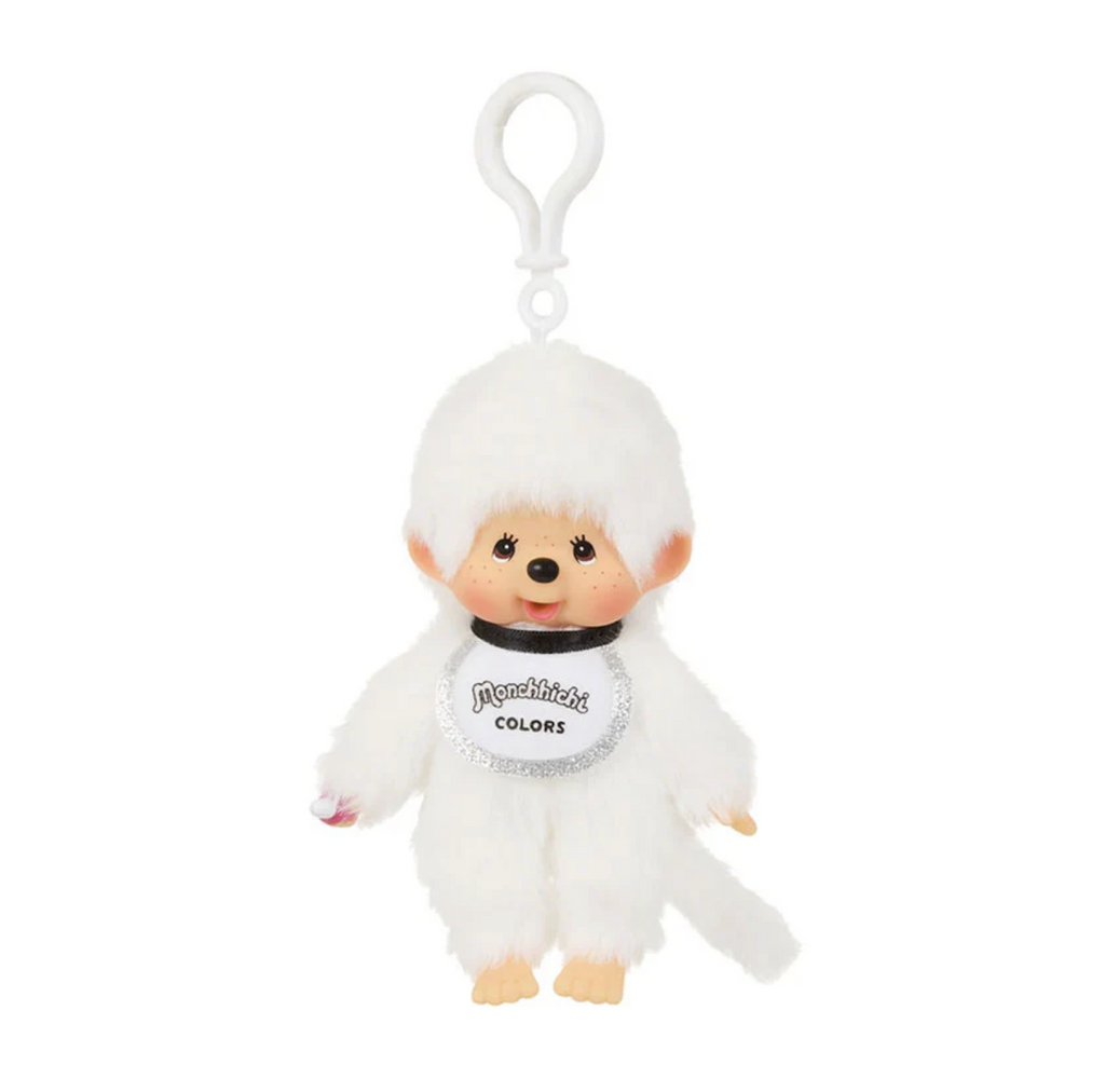 White Monchhichi plush figure with silver sparkly bib attached to a key ring. 