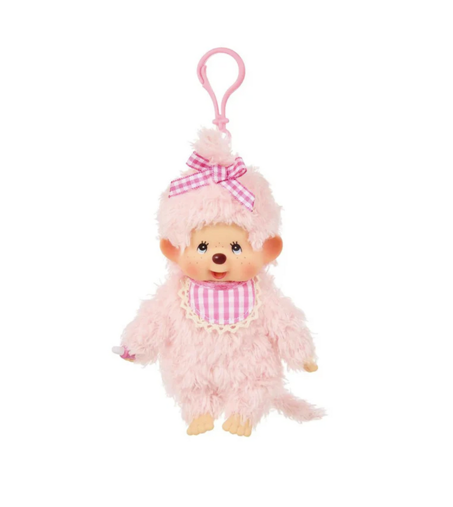 Cute Monchhichi with pink fluffy fur and wearing a pink gingham bib and ribbon attached to a key ring. 