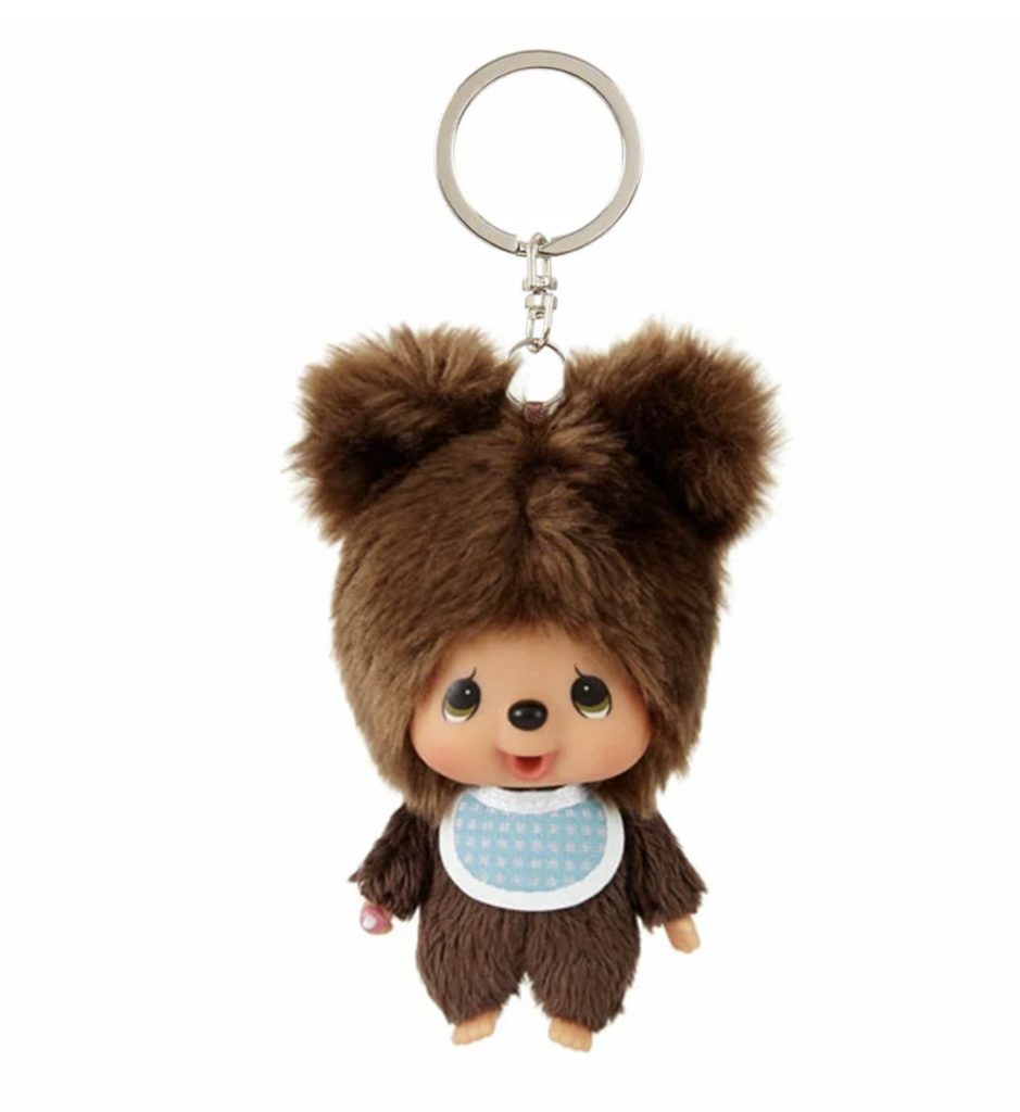 Monchhichi Kuma plush keychain with Monchhhichi dressed as a bear wearing a blue gingham bib. 