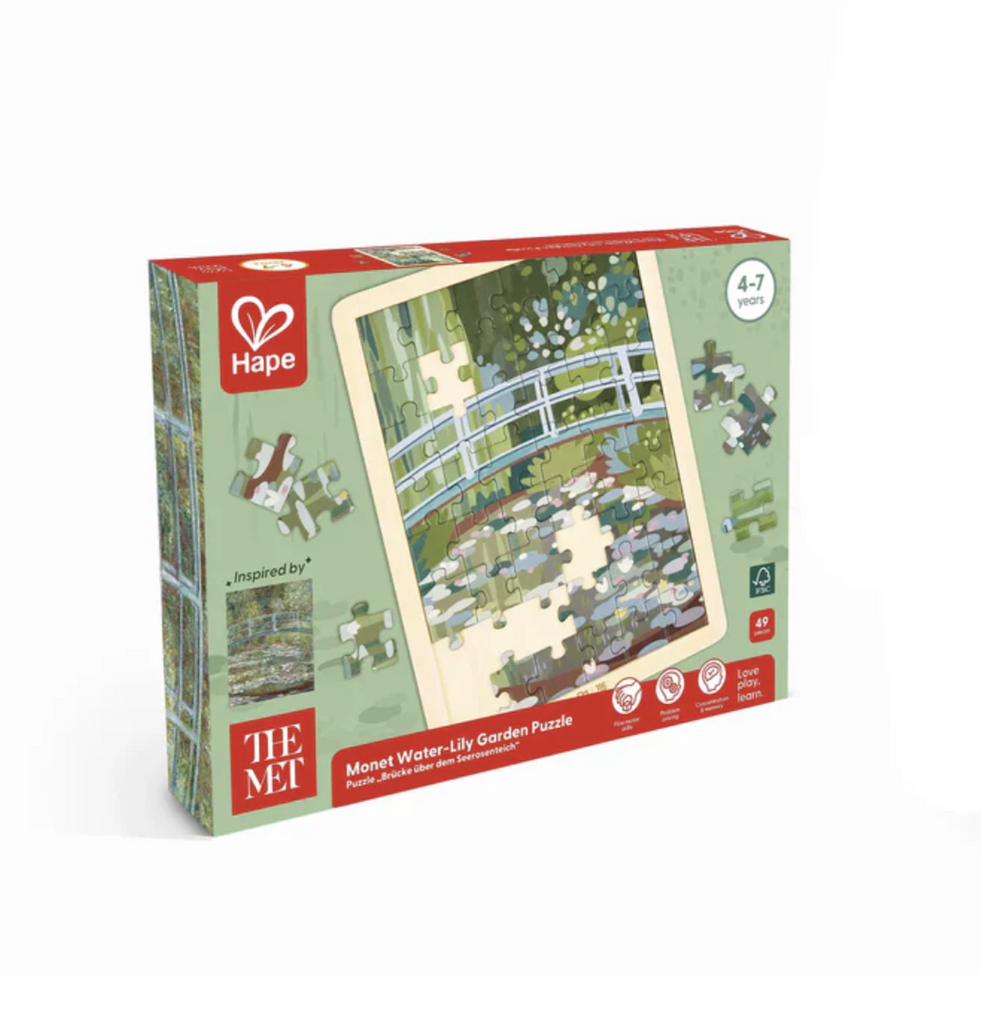 The Monet Water Lily Garden wooden puzzle packaged in a box with illustrations of the puzzle in progress. 
