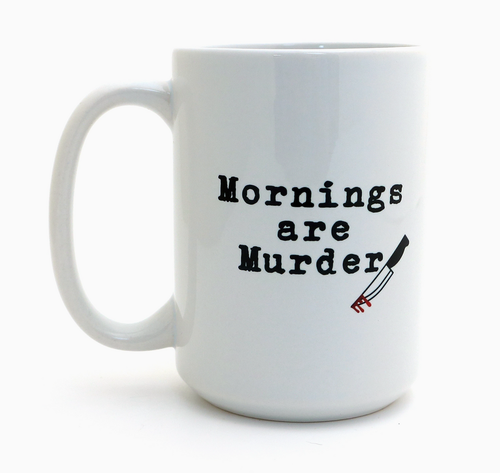 White stoneware mug with 'Mornings are Murder' text and knife graphic on a white background. 