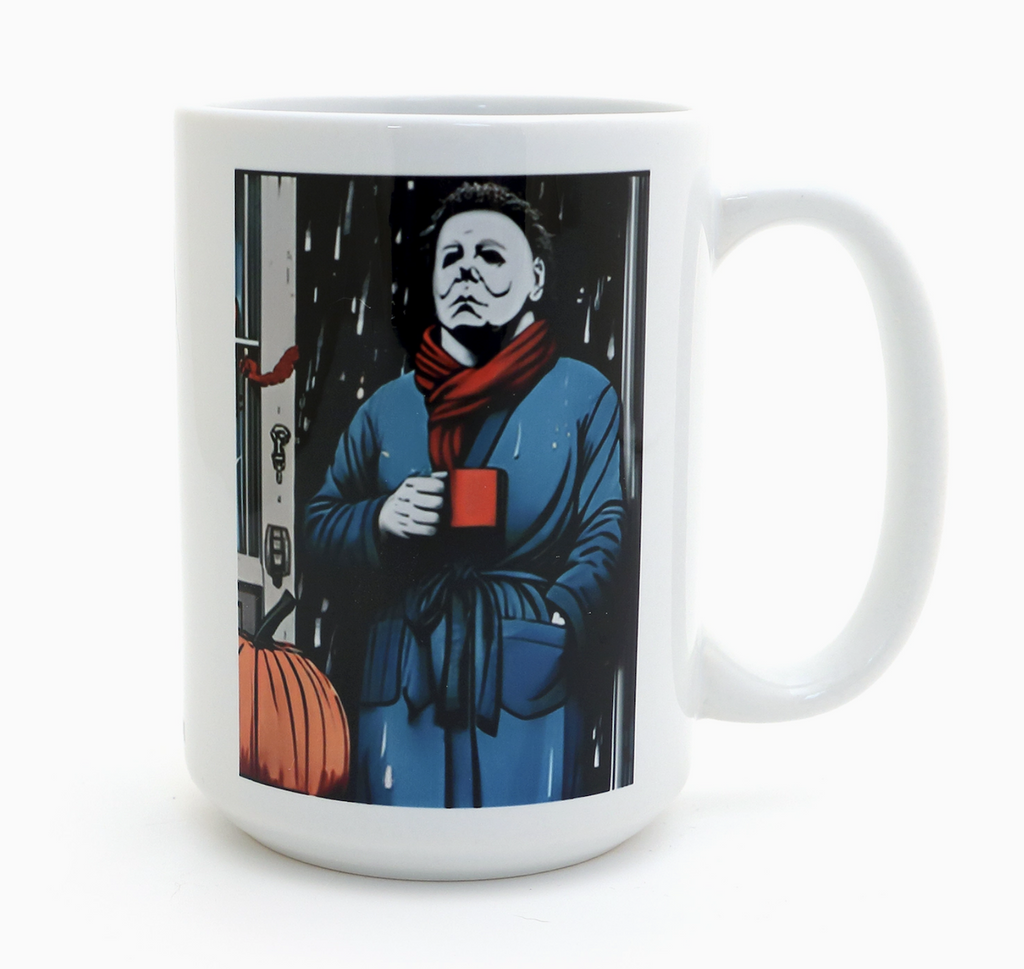 White stoneware mug with a color graphic of Michael Myers wearing a robe, holding a cup of coffee. 