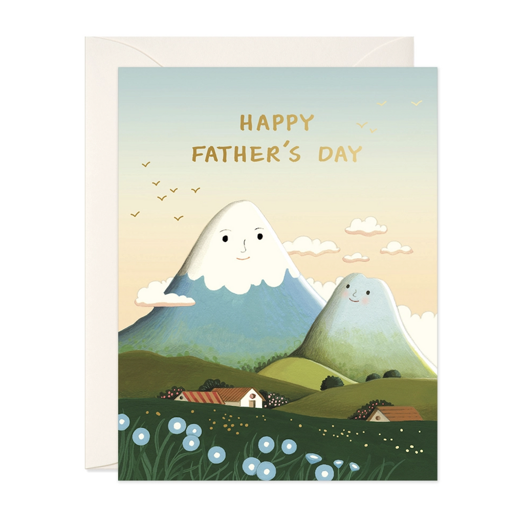 Illustrated greeting card with serene mountains rising above a village that have human faces that reads "Happy Father's Day". 