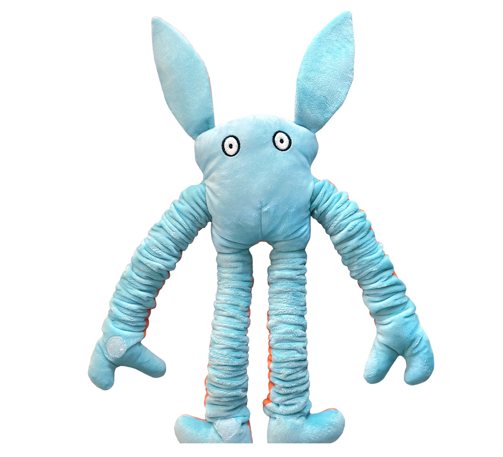 Back side of a Mushies Plush pop doll in blue with it's eyes wide open 