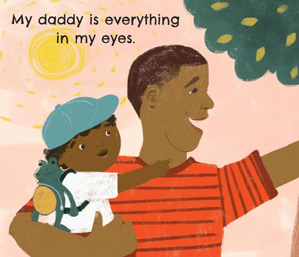 Interior page with an illustration of a father holding his child with text 'My daddy is everything in my eyes.'