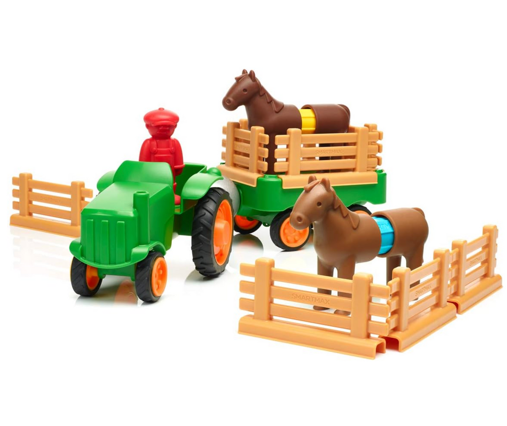 Green tractor pulling a cart with a horse in it and a red farmer figure at the wheel. There is another toy horse behind toy fencing. 