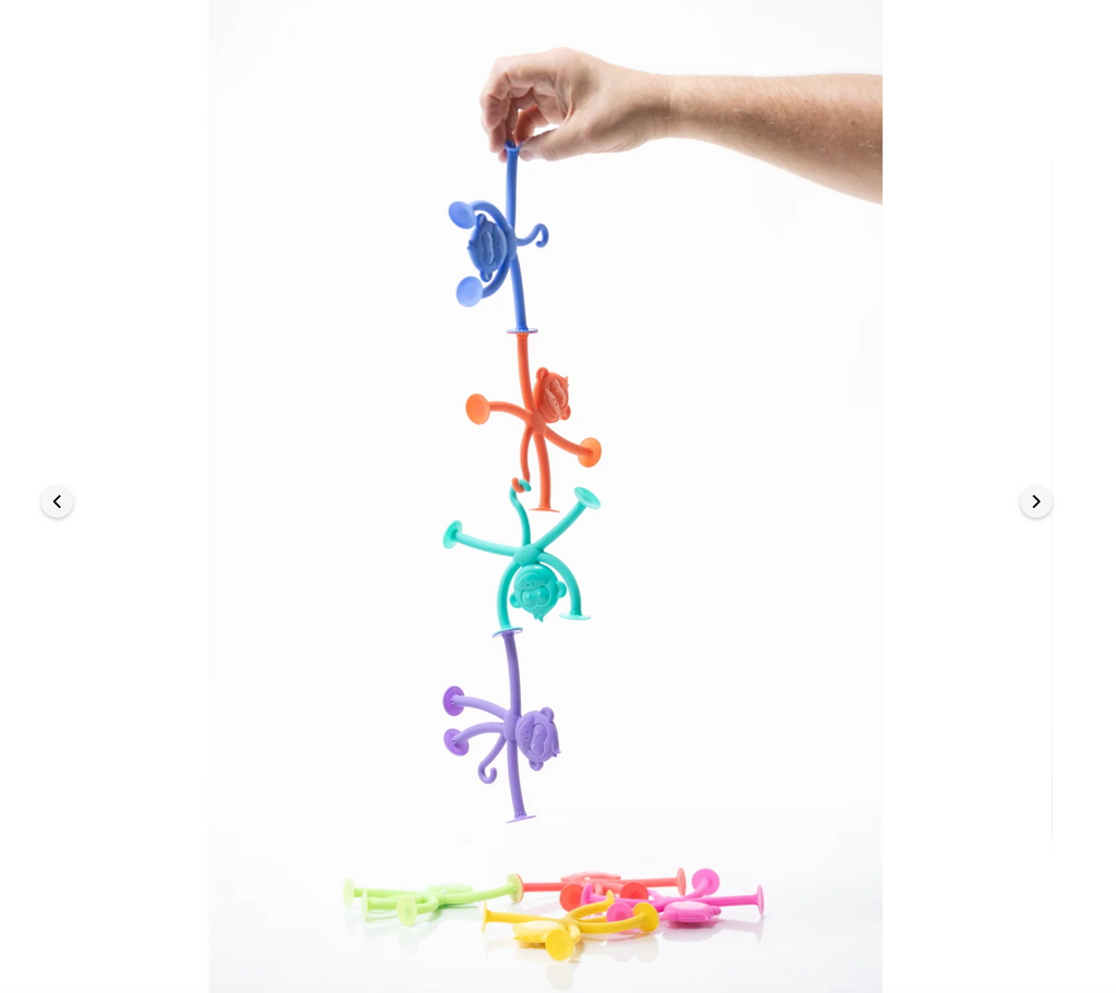 Hand holding several Hangatangs stuck together.