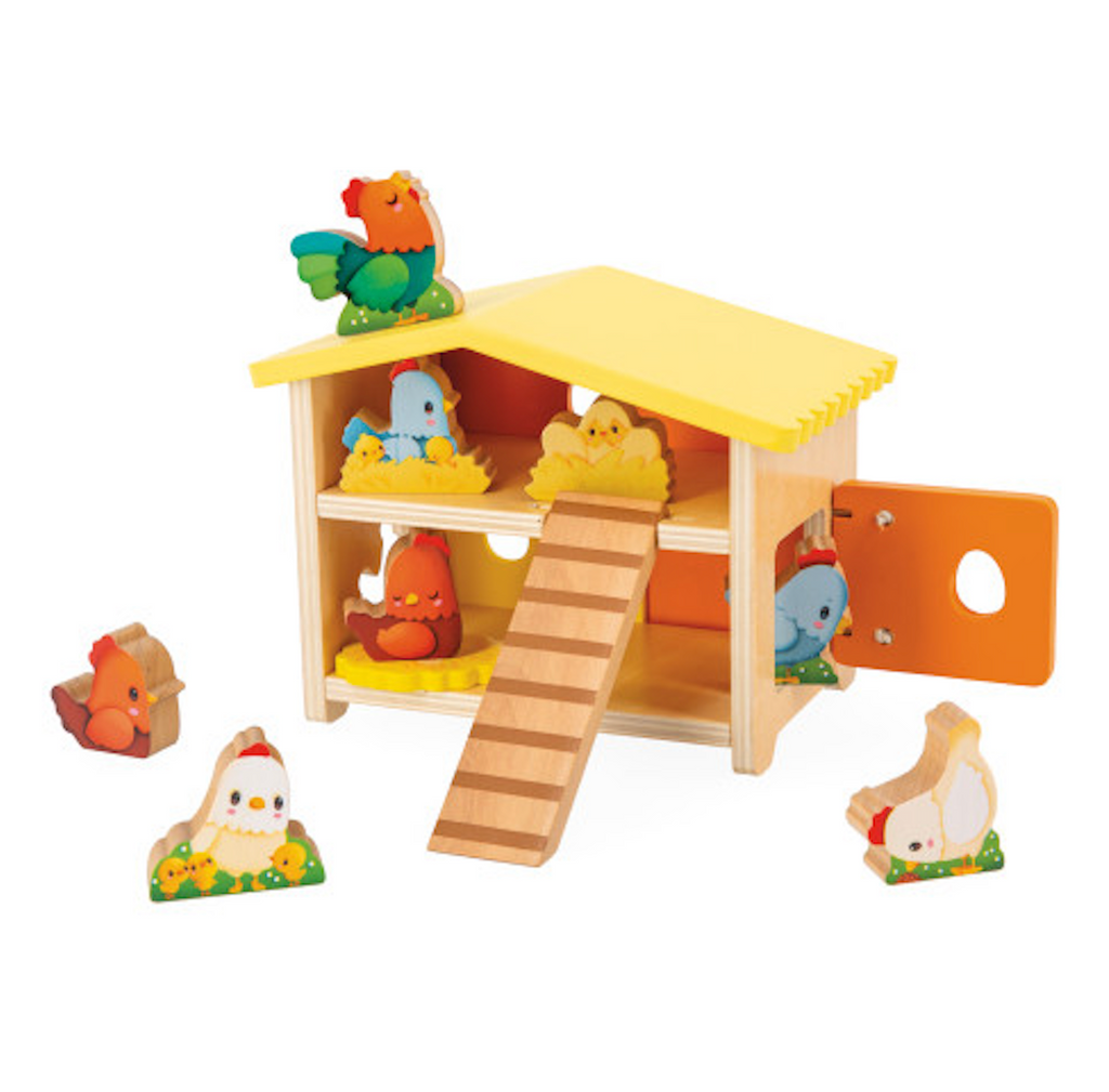 Wooden toy chicken coop with movable door and toy chickens placed in and around the coop. 