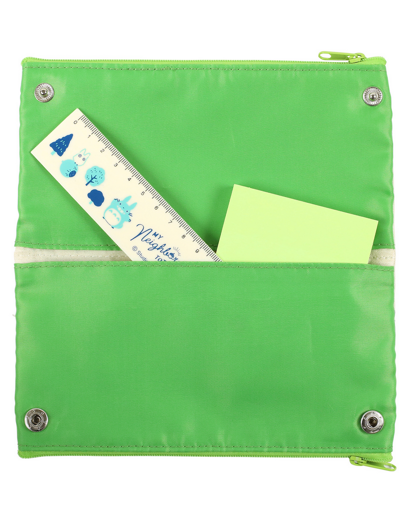 An inside view of an open side of the Totoro Pen Case showing off the bright green lining and snap closure. 