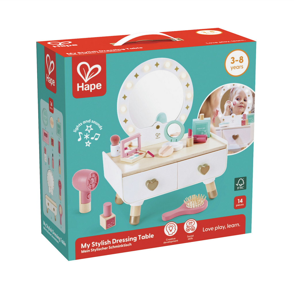 Hape My Stylish Dressing Table packed in a box with a picture of the toy vanity set up with the mirror and accessories. 