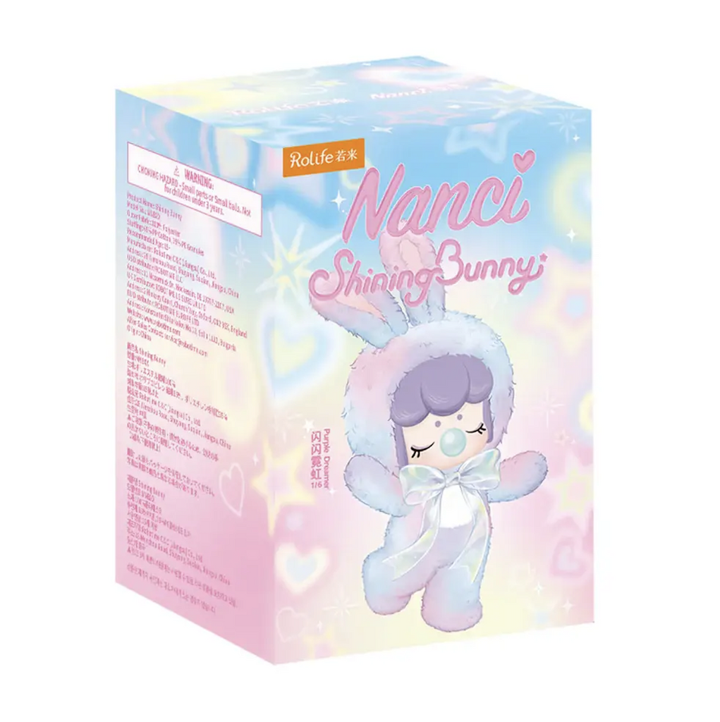 Nanci Shining Bunny box with an illustrated Nanci figure wearing a pastel rainbow colored bunny suit on a background of pastel swirls covering the box. 