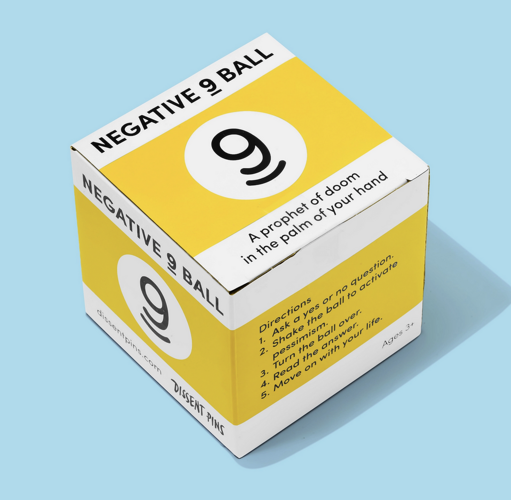 Bright yellow and white box with a 9 printed on it along with the directions as to how to use the Negative 9 Ball. 