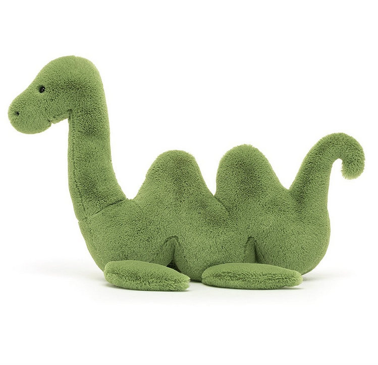 Side view of Nessie Nessa plush with grass-green fur that is beautifully soft, with a wiggly body, flopsy fins, shiny eyes and a beany base.