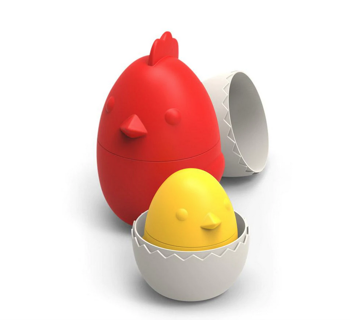 Red chicken measuring cups with a smaller yellow chick measuring cup nesting inside. 