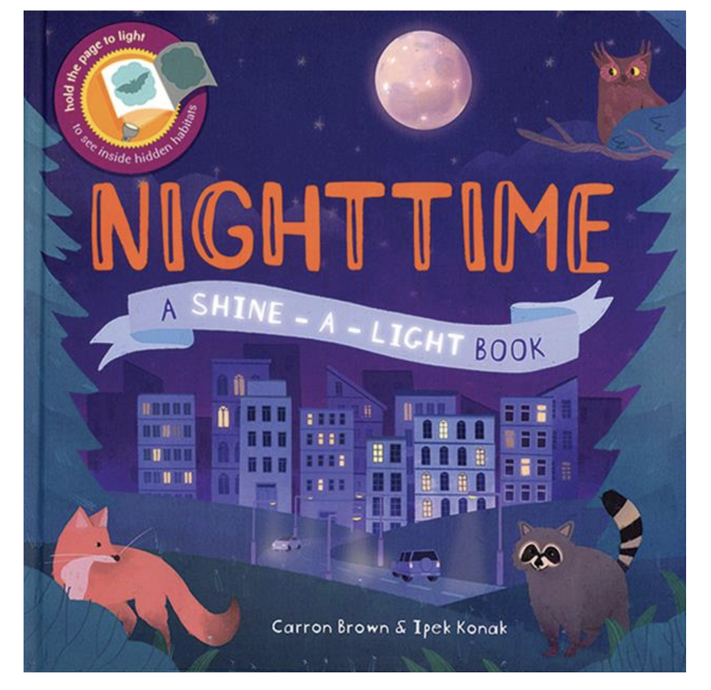 Cover of Nighttime Shine A Light with a beautifully illustrated picture of a fox, raccoon and owl looking from the edge of the woods down to a city illuminated by the lights at night. 