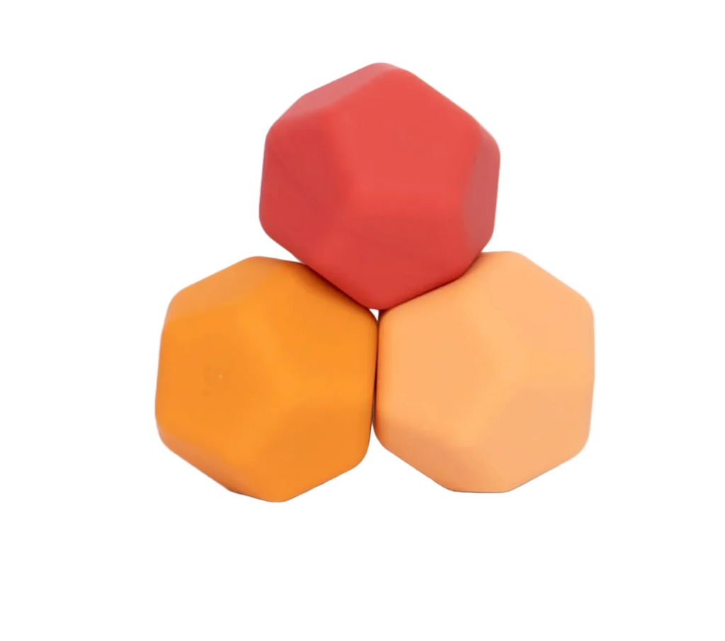 Orange Plane Odds Silicone Magnet set. Three hexagonal magnetic fidget balls in burnt orange, orange and tangerine. 