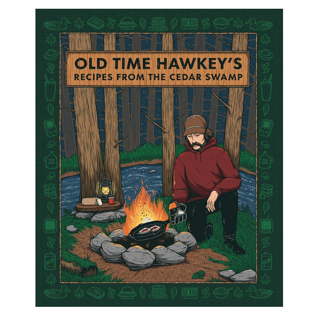 Cover of the cookbook "Old Time Hawkey's Recipes FromThe Cedar Swamp" with an illustration of the author cooking by a campfire.